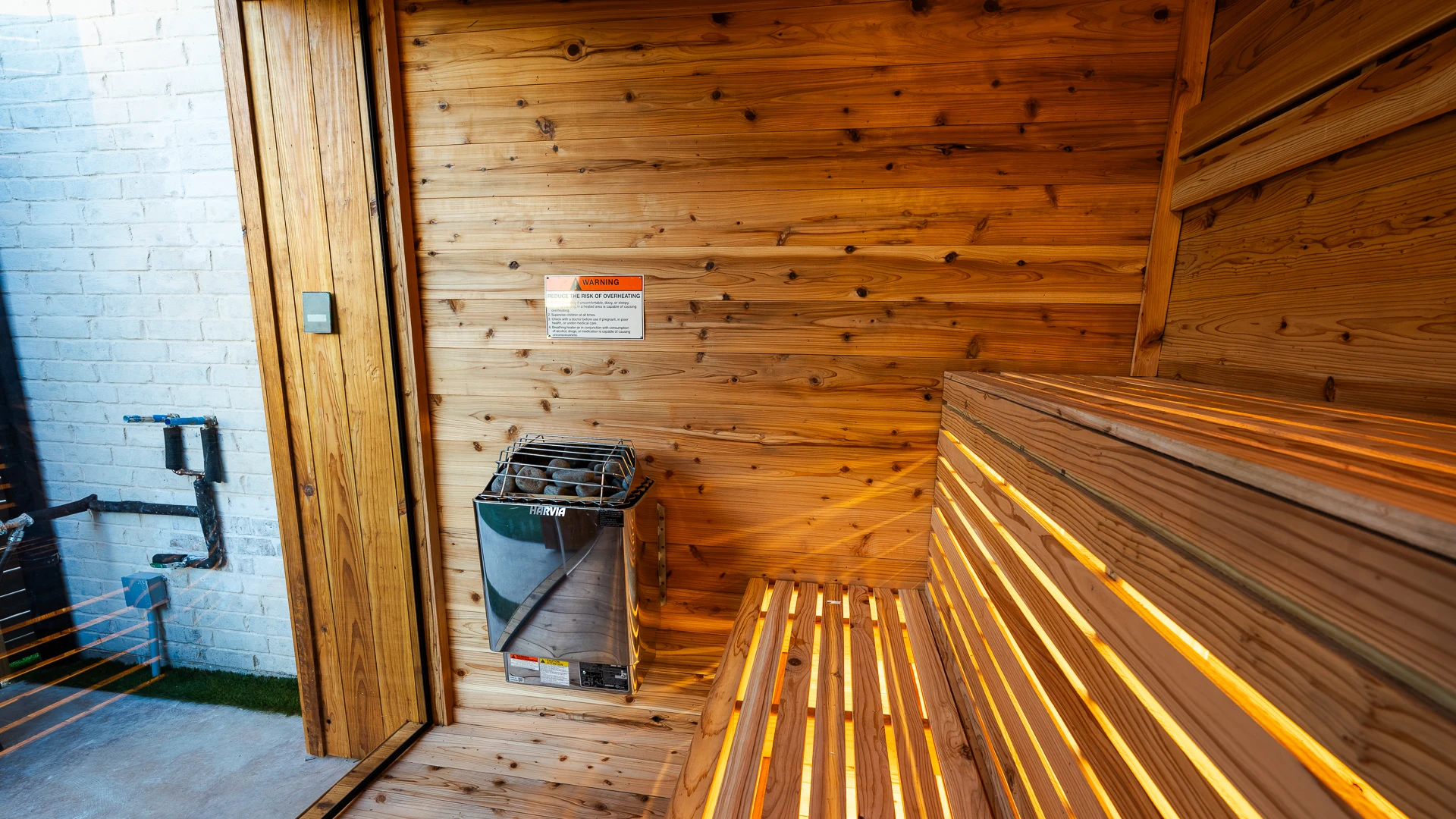 Harvia Xenio digital sauna control panel on cedar wall