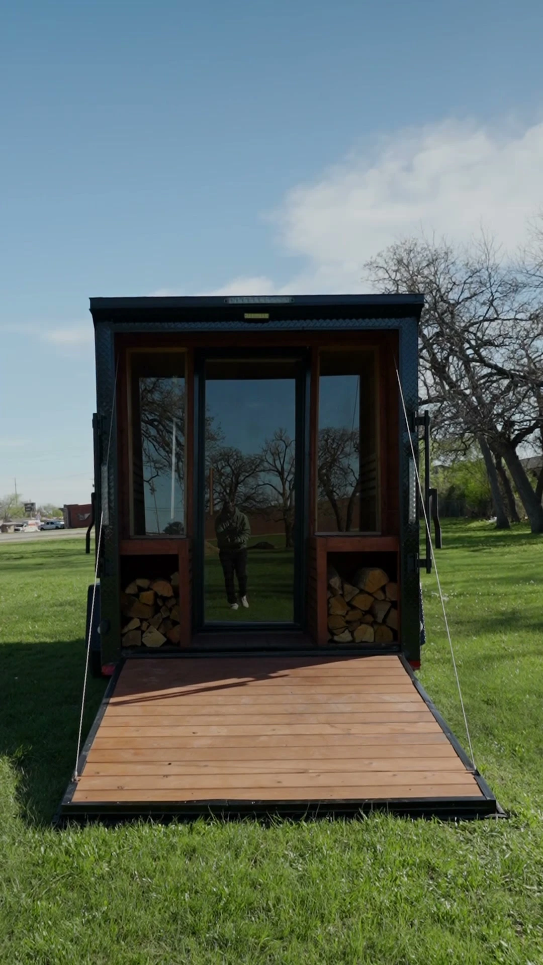 Portable wood-fired sauna trailer exterior with charred cedar siding